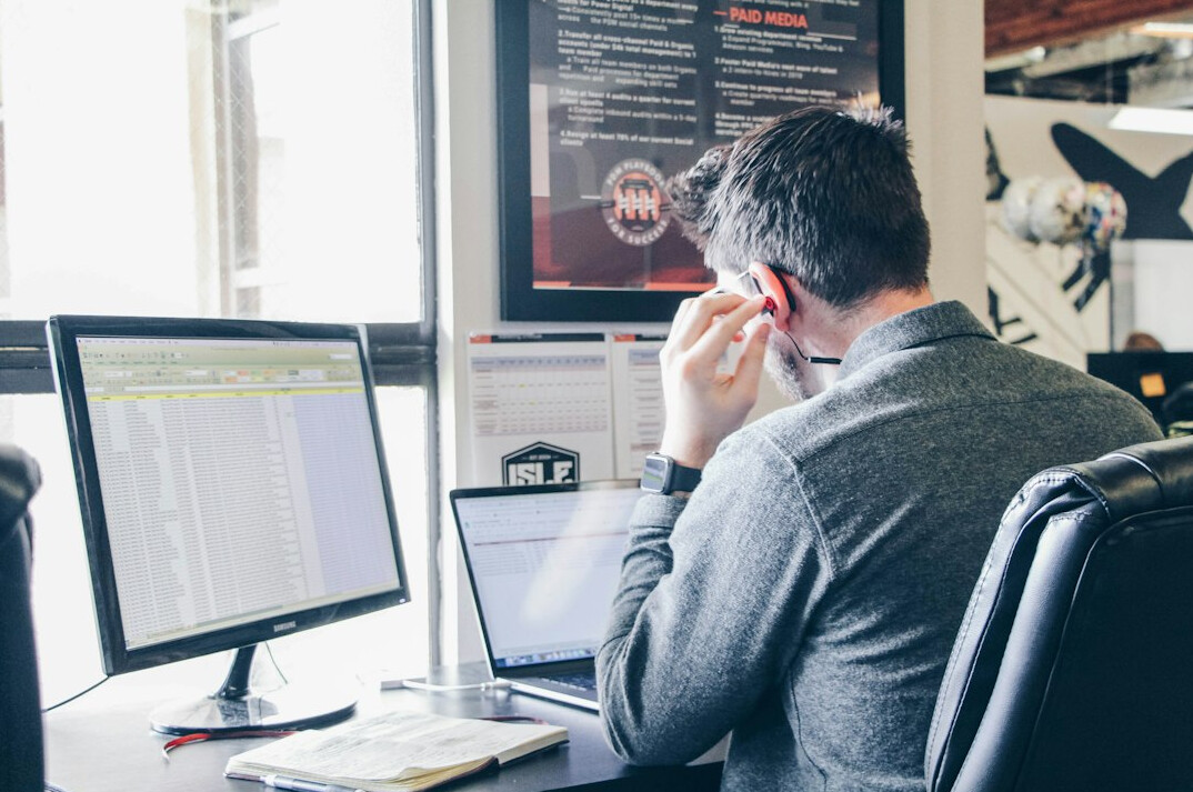 software developer coding at desk